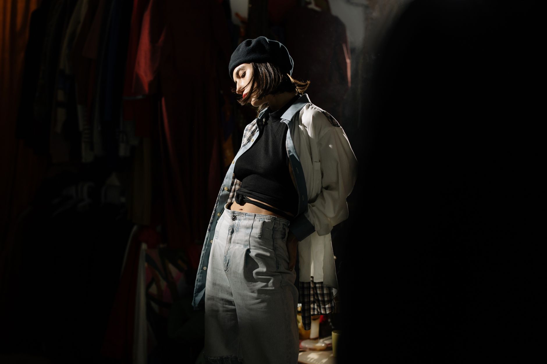 Retro-inspired portrait of a fashionable woman in a casual vintage outfit and beret.